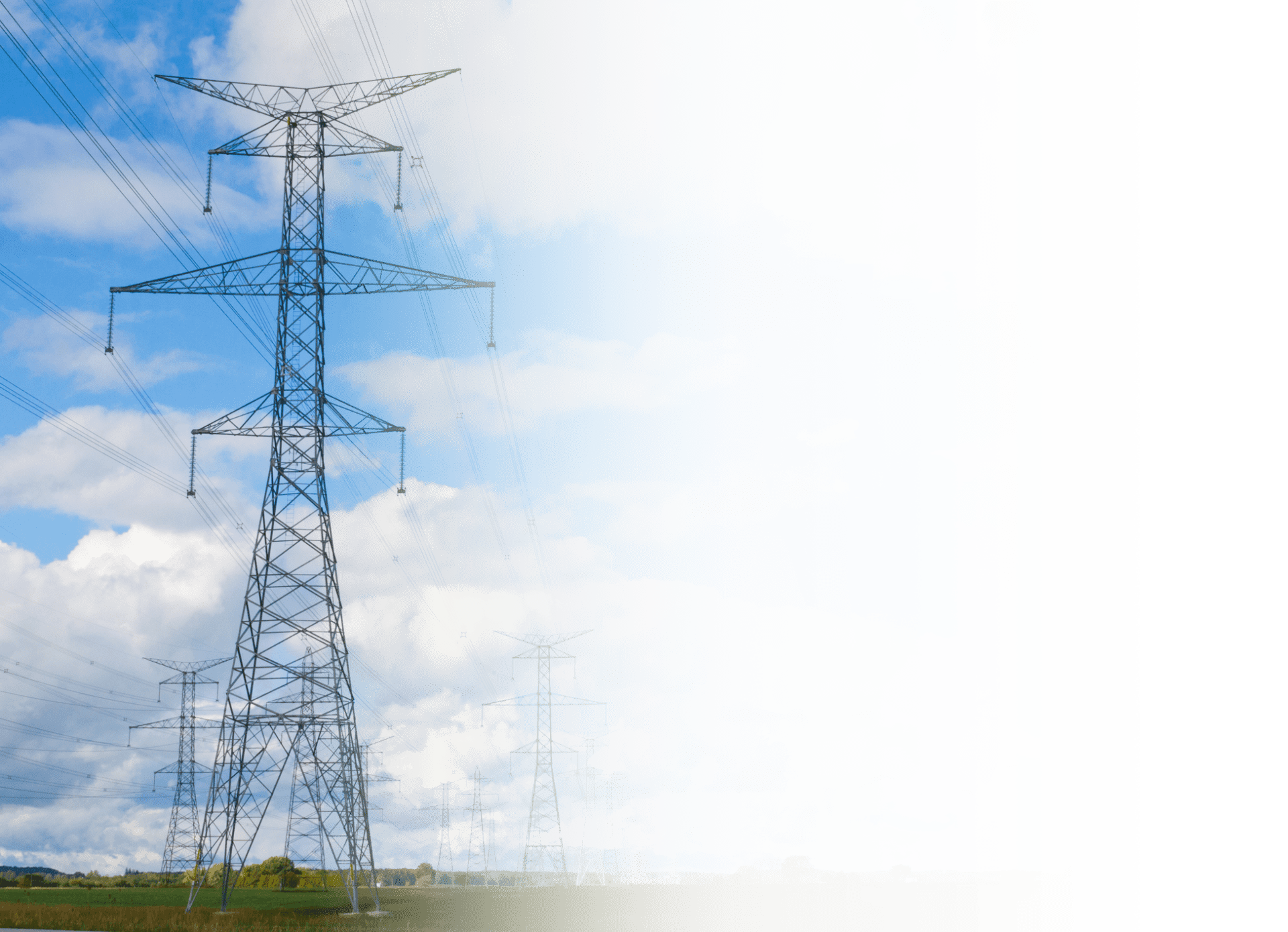 The image is distorted with digital artifacts, showing a landscape with electricity pylons under a blue sky with clouds. Some areas of the image are glitched.