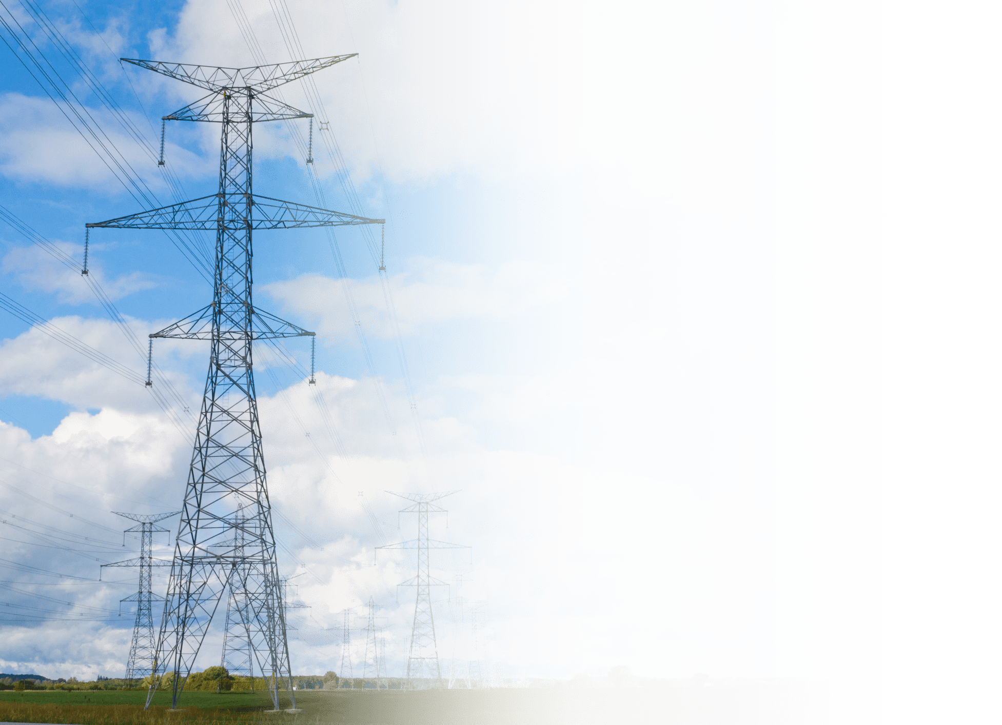 The image is distorted with digital artifacts, showing a landscape with electricity pylons under a blue sky with clouds. Some areas of the image are glitched.